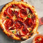 Innovative pizza recipes blending classic Italian and exotic global tastes